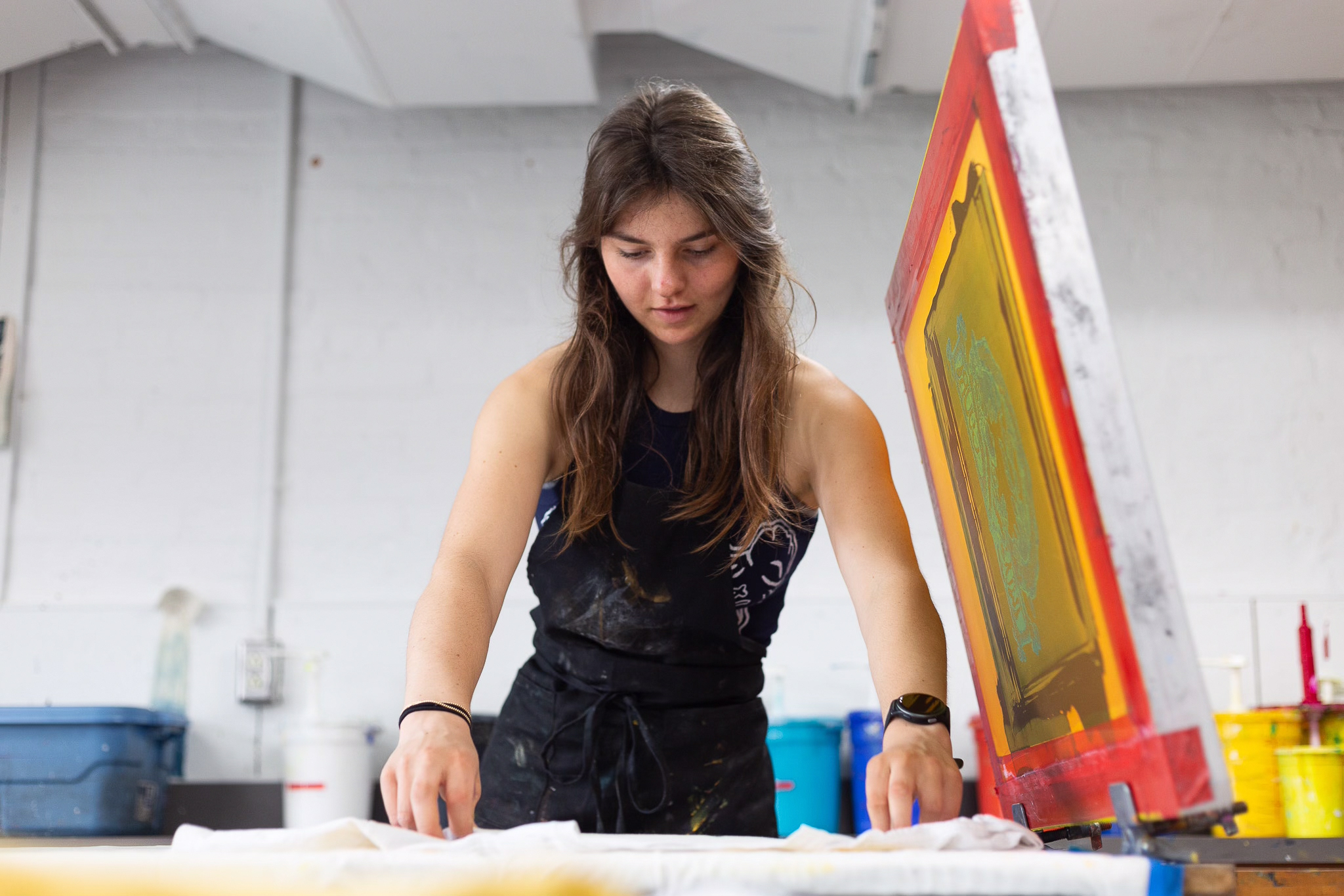 Photo of Arden Conine screenprinting